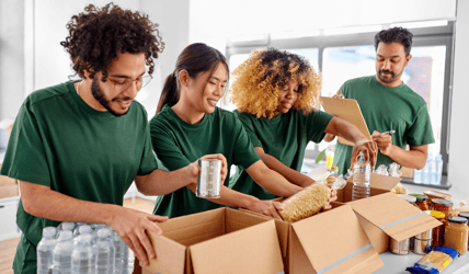 volunteer packing food donation boxes 